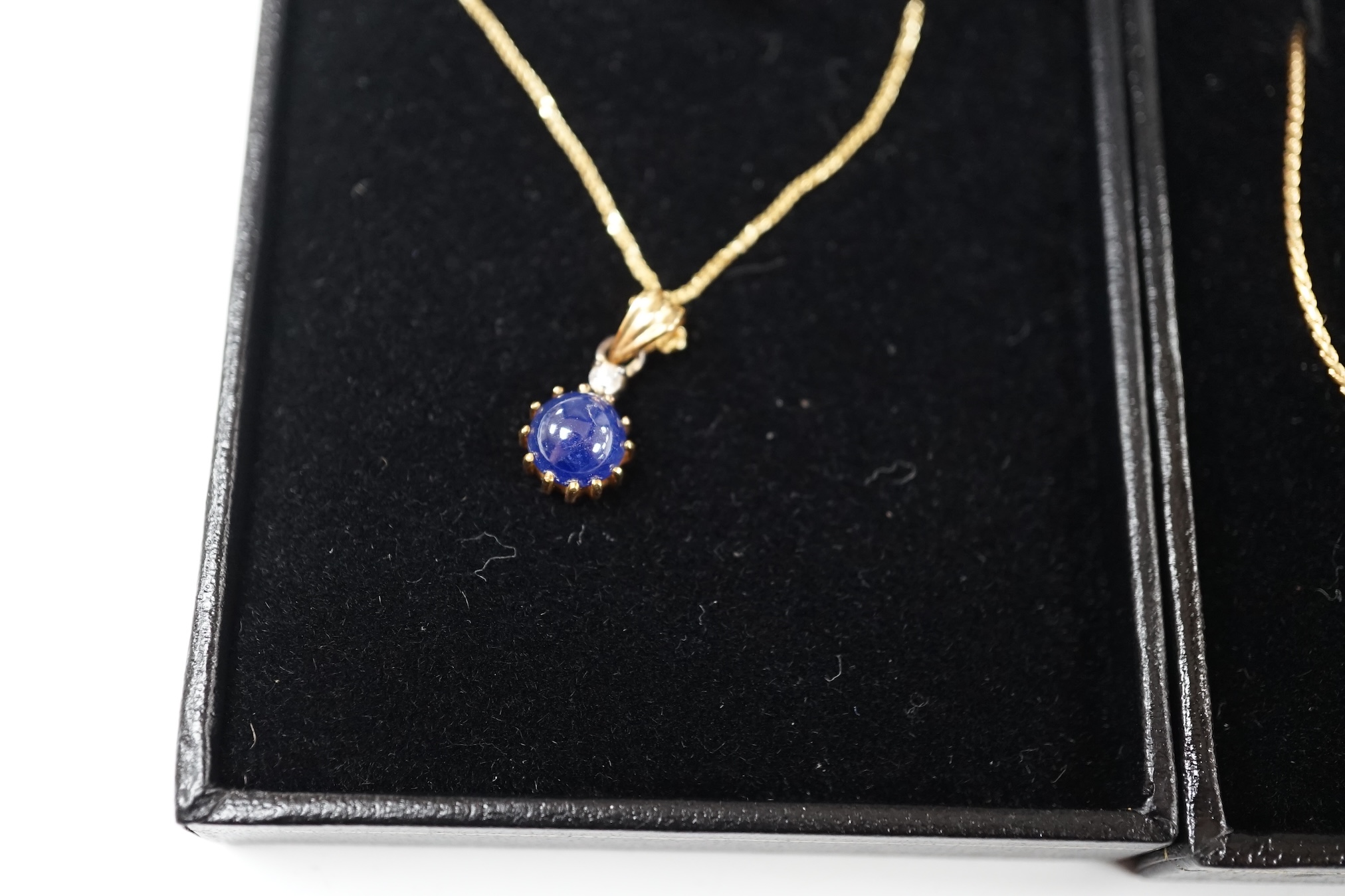 A modern 18k and solitaire diamond set necklet, 36cm, together wit a modern Italian Uno-A-Erre 18k, cabochon sapphire and diamond set necklet, 46cm, gross weight 7 grams. Condition - good